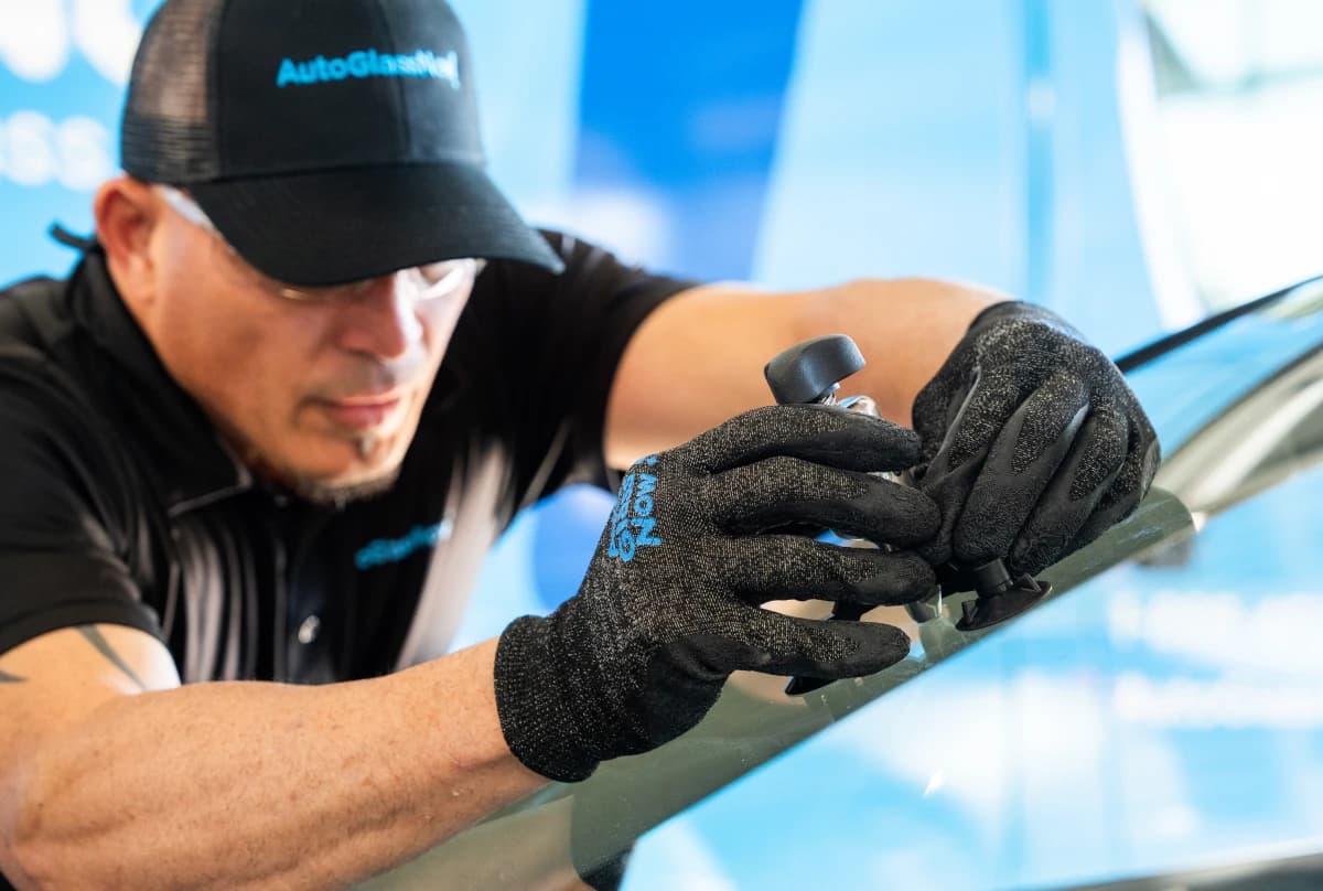 Image Content - Technician fixing windshield close up