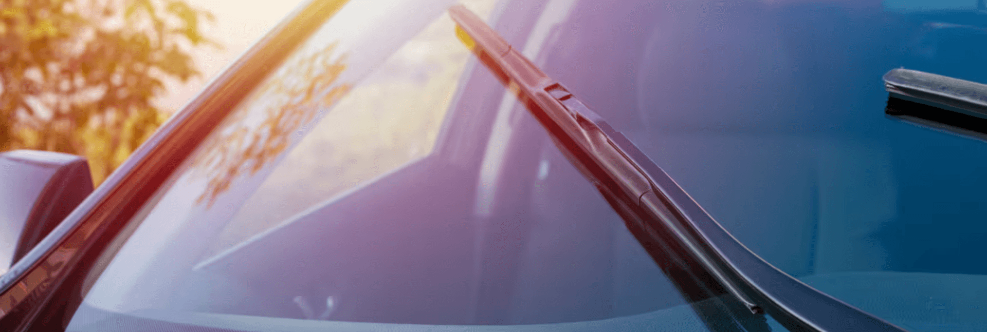 Close up of car windshield and windshield wiper.