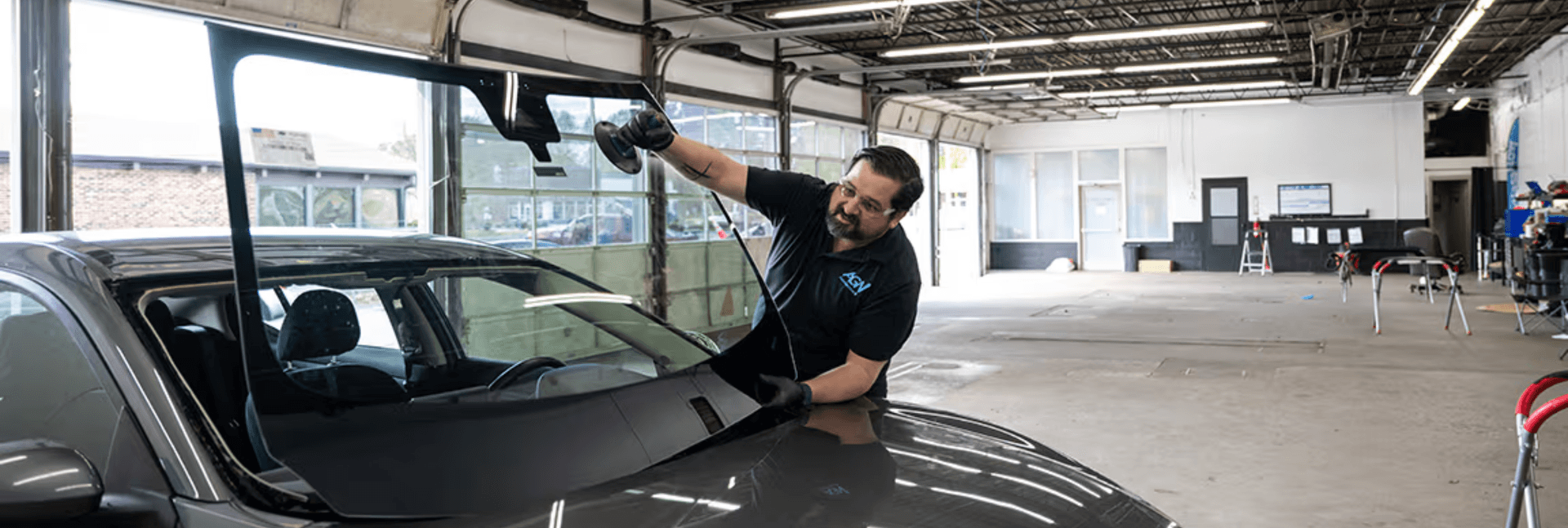 Windshield being installed by an Auto Glass Now technician.