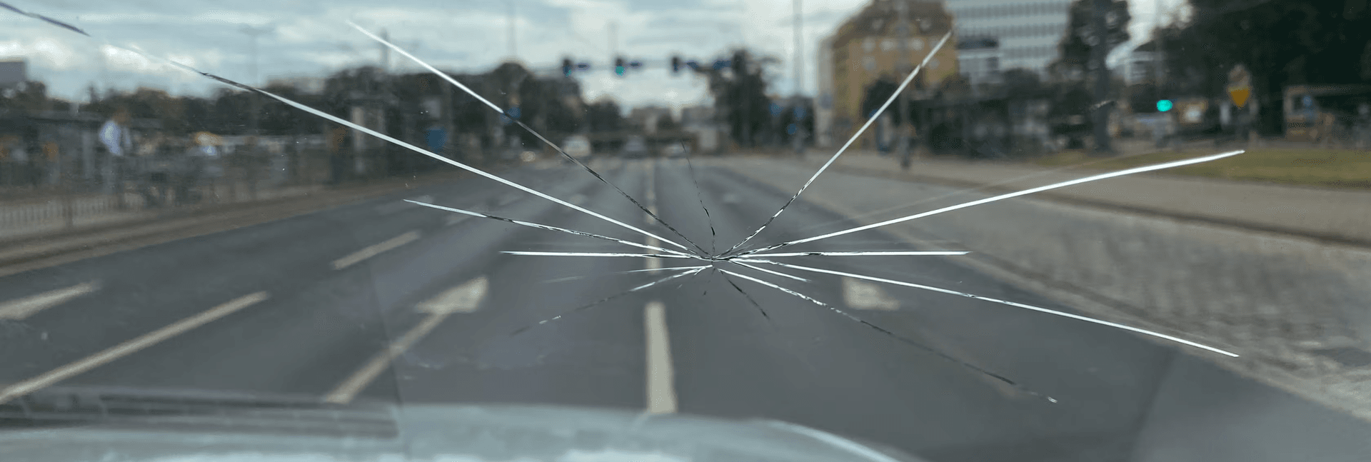 Large spider crack in a windshield.
