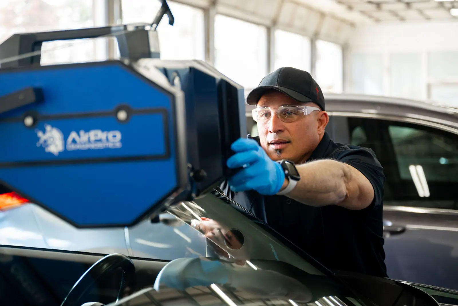 Male technician using calibration equipment.